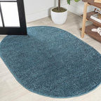 JONATHAN Y Haze Solid Low-Pile Turquoise 4x6 Oval Indoor Area Rug, Minimalist by JONATHANY